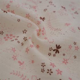 Tissu toile de coton à motif floral marron et rose sur fond beige