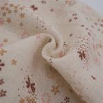 Tissu toile de coton à motif floral marron, ocre et rose pâle sur fond beige